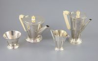 A stylish 1930's Art Deco silver four piece tea and coffee service by Charles Boyton,                                                  