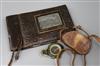 A World War I cased compass and a photo album                                                                                          