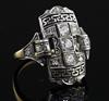 An Art Deco style platinum, yellow gold and diamond set tablet ring, size L.                                                           