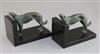 Constant Roux. A pair of bronze and black marble bookends, 7in. height 5.5in.                                                          