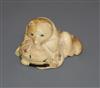 A Japanese Meiji period carved ivory netsuke of a fox cub on a cushion, with inset eyes 3.5cm high                                     