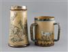 Barlow family. A Doulton Lambeth three handled stoneware tyg and a similar jug, H. 16.5 and 23.5cm, jug handle re-stuck (2)            