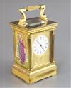 An Edwardian ormolu and porcelain hour repeating carriage clock, height 6.75in., with brown leather travelling case                    