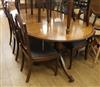 A Regency style mahogany twin pillar dining table and eight chairs, (6 plus 2 carvers). W.213cm with leaf                              