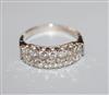 An 18ct white metal and diamond set double row half hoop ring, size M/N.                                                               