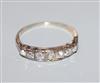 A white metal and graduated seven stone diamond half hoop ring, size K.                                                                