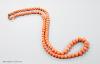 A large single strand graduated coral bead necklace, with yellow metal clasp, 80cm, gross weight 123 grams                                                                                                                  