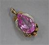 A yellow metal, pear shaped pink synthetic sapphire and diamond set pendant, overall 37mm.                                             