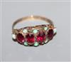 A late Victorian 9ct gold, ruby and opal half-hoop ring, Nathan Bros, Birmingham, size P.                                              