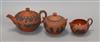 Three Wedgwood Rosso Antico items - a teapot and cover, milk jug and sucrier                                                           