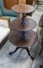 A George III circular mahogany three tier dumb waiter, diameter 60cm, height 106cm                                                                                                                                          