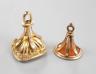 A late Victorian yellow metal and carnelian set fob seal, 23mm and a George V 9ct gold and bloodstone set fob seal.                                                                                                         
