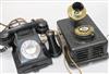 A 1920s 'long distance' telephone and a black Bakelite GPO phone.                                                                      