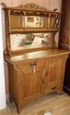 An Arts and Crafts oak side cabinet W.122cm                                                                                            