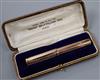 A boxed Swan 9ct gold engine-turned self-filling fountain pen.                                                                         