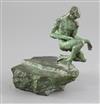 Tom Merrifield (1933-). A bronze model of a nude crouched upon a rock, height 6.5in.                                                   