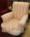 A late Victorian Howard style chair with loose cover                                                                                   