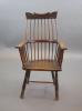 A primitive comb back Windsor armchair, possibly West Country, 67cm wide, 39cm deep, 106cm high.                                                                                                                            