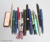 A small collection of assorted pens                                                                                                                                                                                         