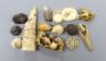 A collection of Japanese ivory and wood netsuke and okimono                                                                                                                                                                 