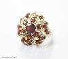 A modern 14ct gold and garnet cluster dress ring, size M/N, gross 7.4 grams                                                                                                                                                 