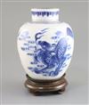 A Chinese blue and white 'qilin' jar and cover, Kangxi period, H. 16cm, wood stand                                                     