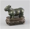 A Chinese gold and silver inlaid bronze figure of a tapir, Han dynasty or later, L. 12cm, excluding hardwood stand and fitted box      