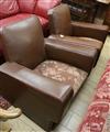 A pair of leather club chairs                                                                                                          