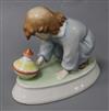 A Zsolnay ceramic model of a young child with a spinning top height 12cm                                                               