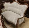 A French walnut showframe settee, W.176cm                                                                                              