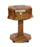 A mid 19th century tortoiseshell veneered pedestal work table, 48cm high 34cm diameter                                                                                                                                      