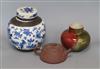 A Chinese squat baluster vase, crackle-glazed in green and red, a blue and white ginger jar and cover and a redware teapot             