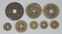 China, 8 bronze charms or amulets, Qing dynasty,                                                                                       