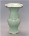 A Chinese Gu-shaped celadon vase, with floral decoration in relief and unglazed base, H 35.5cm                                         