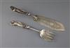 A pair of Victorian silver fish servers, with cast figural handles modelled as a fisherman and his wife, Francis Higgins III,          