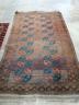 An Afghan red ground rug, 240 x 146cm                                                                                                                                                                                       