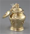 A 1930's silver gilt tea caddy and cover, with matching caddy spoon, by Goldsmiths & Silversmiths Co Ltd, 6 oz.                        