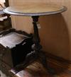 A circular Victorian walnut tripod table W.59.5cm                                                                                      