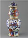 A large Chinese clobbered blue and white double gourd vase and cover, Kangxi period, H.42.5cm, cover repaired, crack to neck           