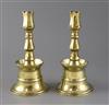 A pair of 17th century Ottoman brass bell based candlesticks, H.9in.                                                                   