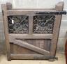A pair of oak and wrought iron gates, each width 107cm, height 133cm                                                                                                                                                        
