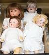 A group of four bisque-headed dolls with jointed composition bodies,                                                                   