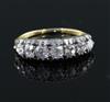 An early 20th century gold and graduated old cut diamond seven stone diamond half hoop ring, size M.                                   