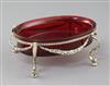 A 19th century continental silver gilt oval stand with ruby glass bowl, 18.5cm.                                                        