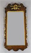 A George III figured walnut and giltwood wall mirror, W.1ft 10in. H.3ft 8in.                                                           