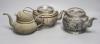 A trio of Chinese pewter mounted Yixing teapots                                                                                                                                                                             