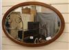 An Edwardian banded oval mirror W.77cm                                                                                                 