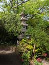 A carved pink granite six tier pagoda garden lantern, Height 10ft                                                                      