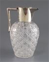 An Edwardian silver mounted cut glass claret jug, John Grinsell & Sons, 19.2cm.                                                        