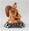 A Chinese boxwood seated figure of a fisherman, with hongmu stand, c.1900, H.15cm                                                      